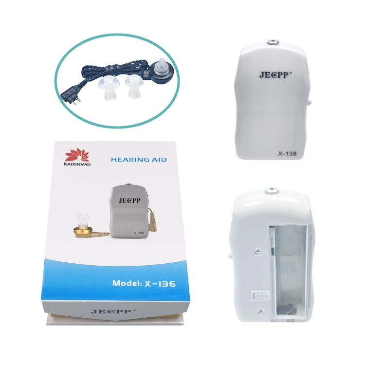 Hearing aid amplifier kit with white device, instruction package, and ear tips
