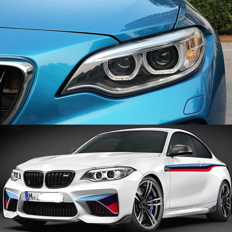 BMW 2 Series coupe showing right headlight with LED angel eyes lighting