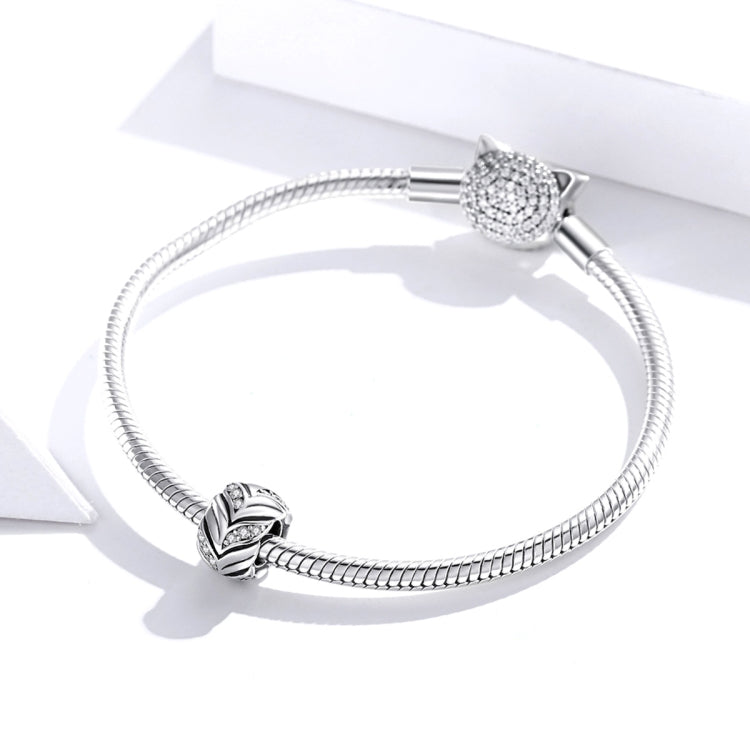 Sterling silver charm bracelet with two bead accents, one pavé-set