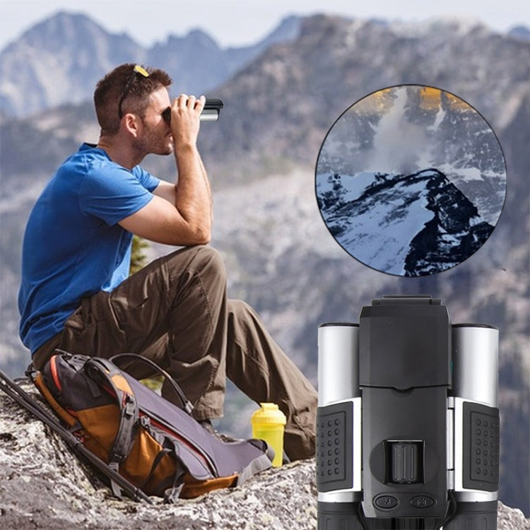 Digital binocular telescope with LCD screen in use, black and silver