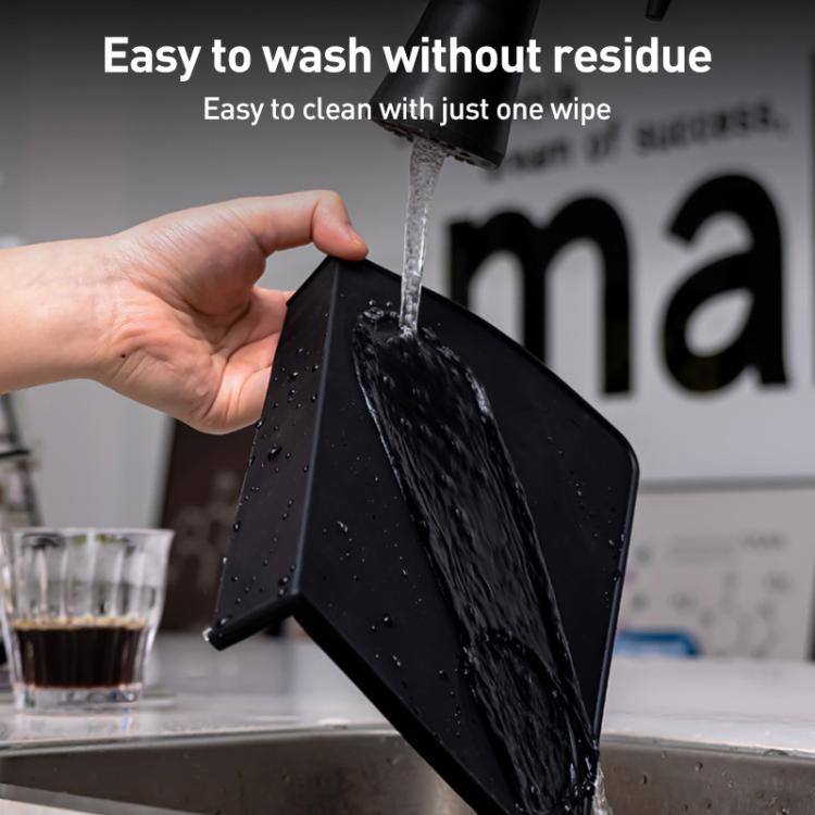 Black silicone espresso tamper mat insert with water droplets, foldable for cleaning
