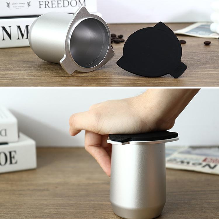 Black silicone lid on a metal powder cup for a coffee machine