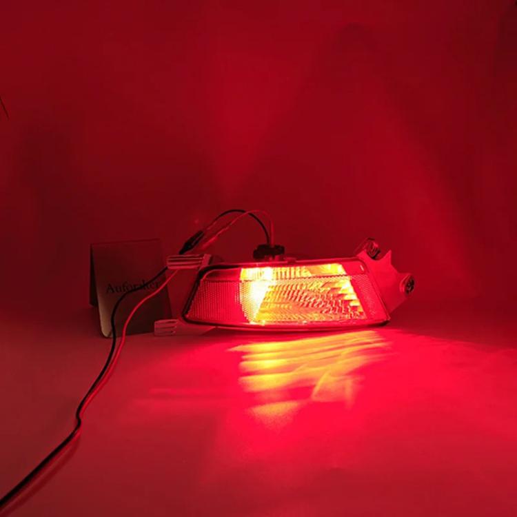 Illuminated amber rear bumper fog light unit with red lens and clear reflector