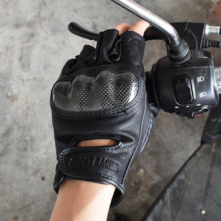 Hand wearing GHOST RACING black half-finger motorcycle glove with mesh knuckle panel