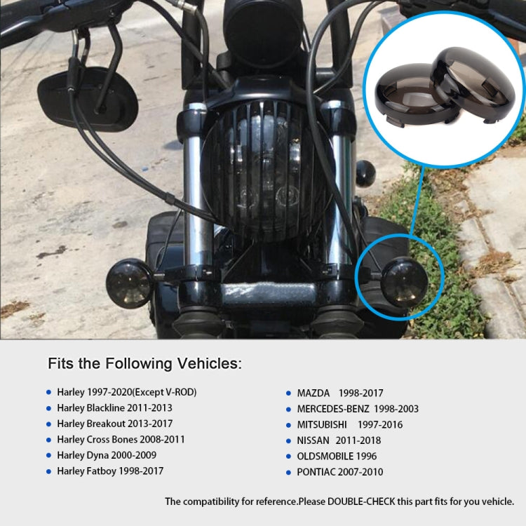 Black motorcycle front turn signal cover highlighted on handlebars area