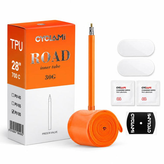 Orange TPU road bicycle inner tube with Presta valve, rolled tube and two repair pads