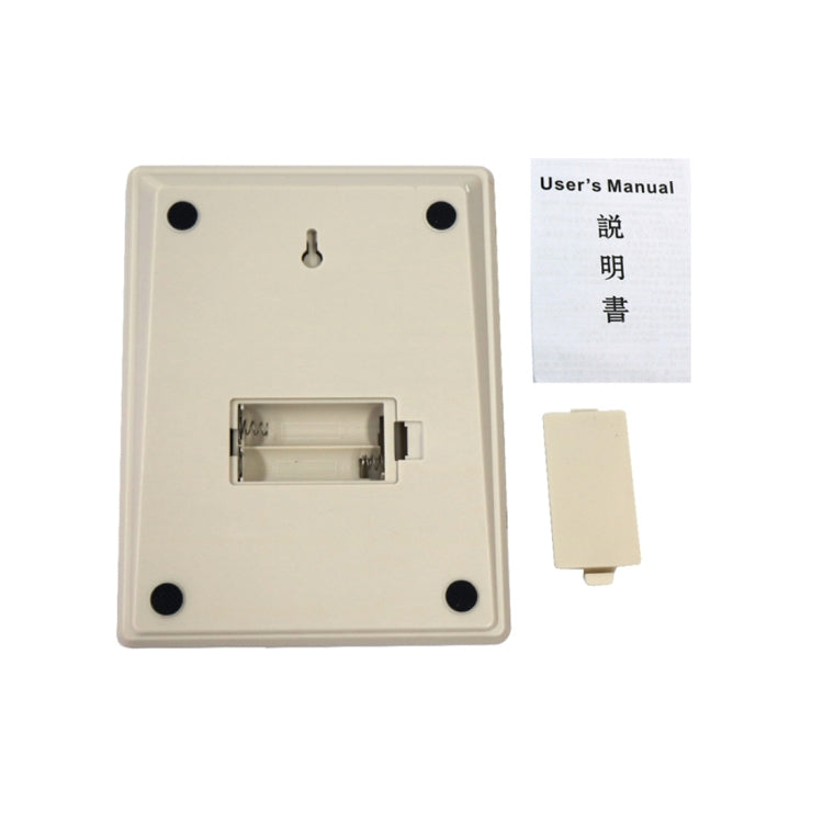 Back of digital kitchen scale with battery compartment and included user manual