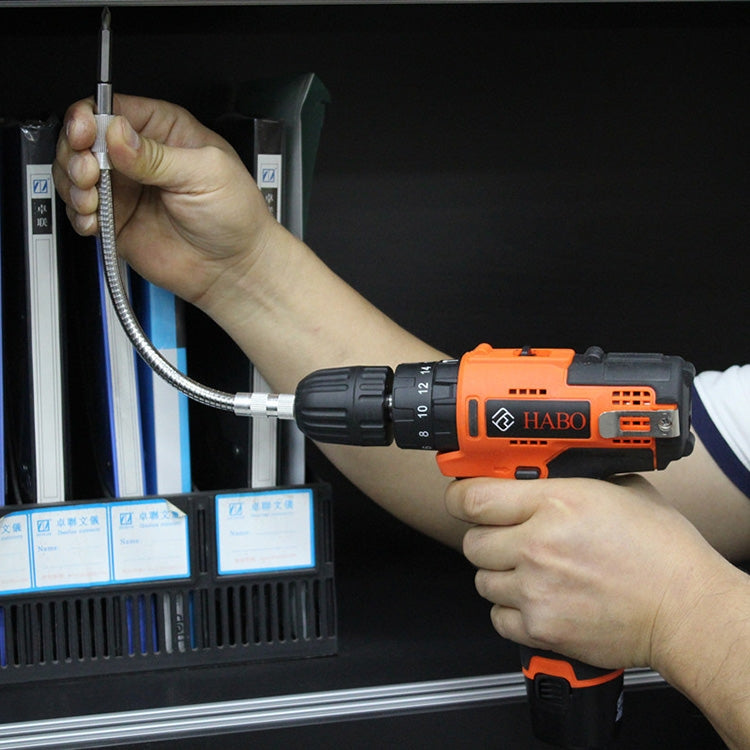 Orange rechargeable drill driver holding a flexible shaft drill rod extension