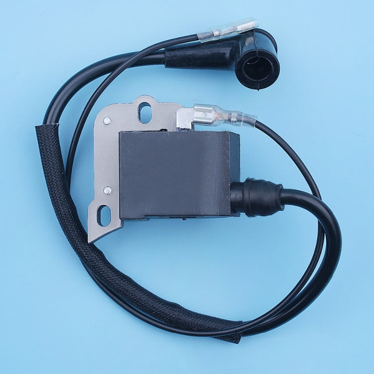 Ignition coil magneto close-up with black block, mounting plate, and wire boots
