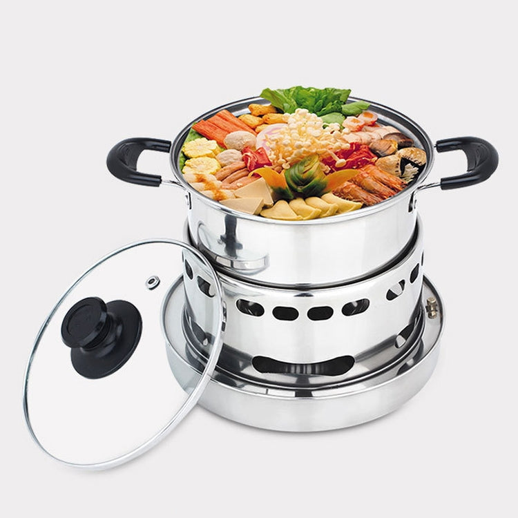 Stainless steel small pot on alcohol stove base, lid on, filled with cooked food