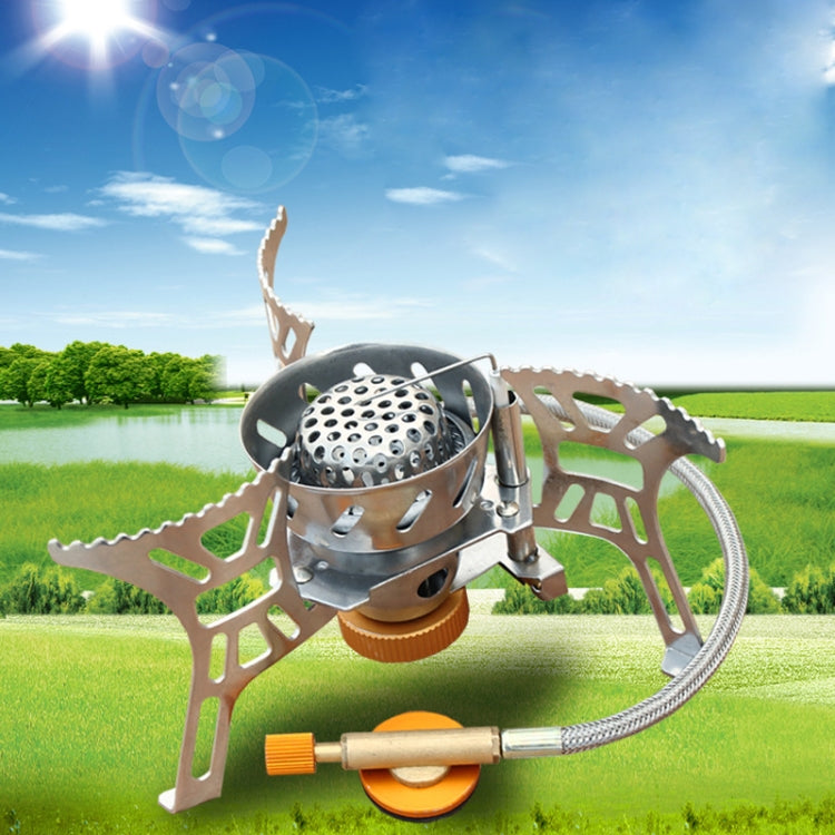 Portable outdoor stove with burner, metal stand, and connected hose/regulator
