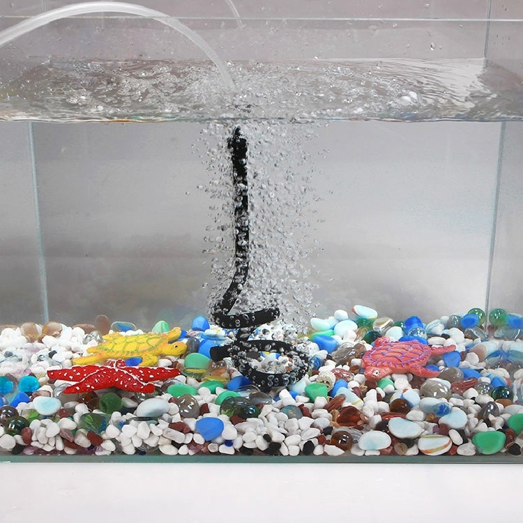 Single-head bubble diffuser hose producing rising bubbles above gravel