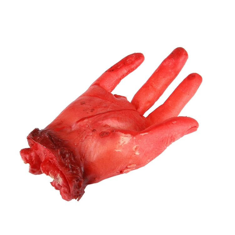 Bloody four-finger fake hand prop, red faux hand with torn, dark wrist end.