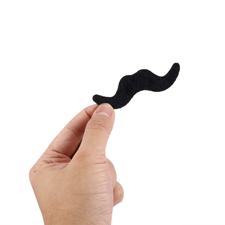 Black felt fake mustache with self-adhesive backing held by hand