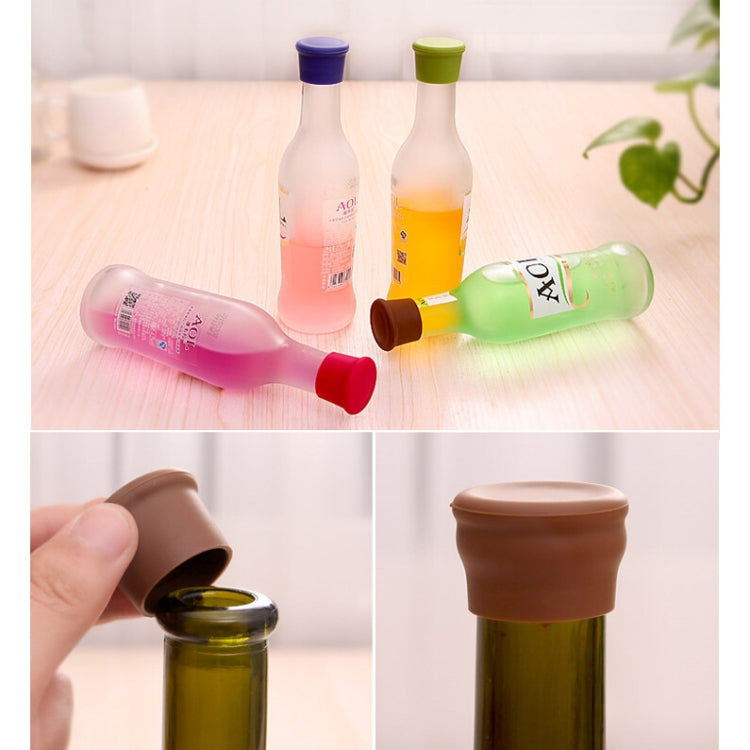 10-piece silicone bottle stopper set, colorful caps on bottles with one cap in hand