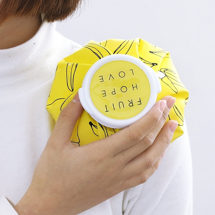 Yellow cartoon hot cold therapy bag with round lid held on a person