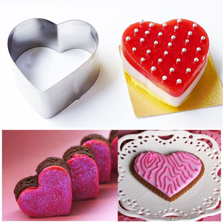 Heart-shaped stainless steel cookie cutter with heart cake and decorative icing
