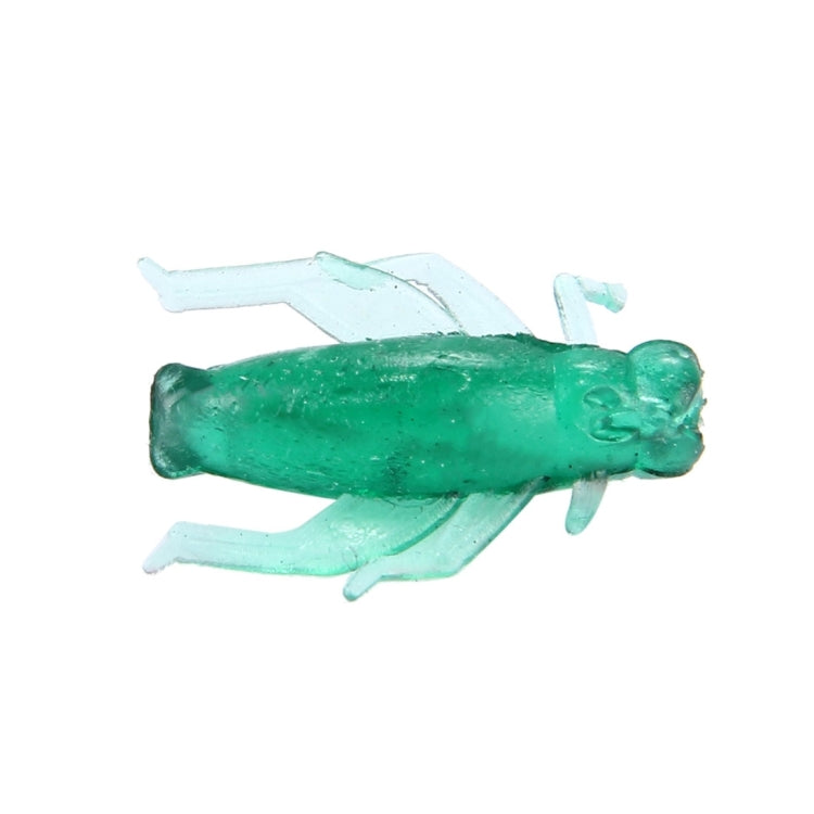 Green translucent cricket-shaped fishing lure, side profile with legs extended