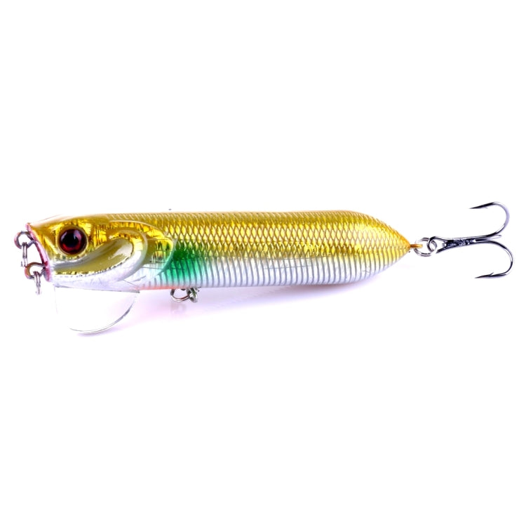 Gold popper fishing lure with green stripe detail and treble hooks