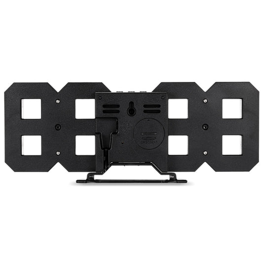 Black back plate of an LED digital wall alarm clock with mounting holes and controls
