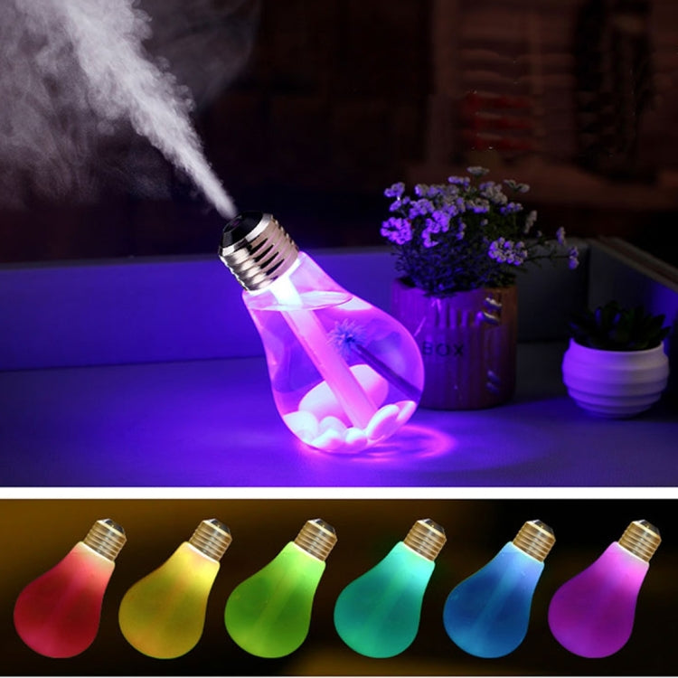 Bulb-shaped humidifier with purple LED glow and silver metal top, releasing mist