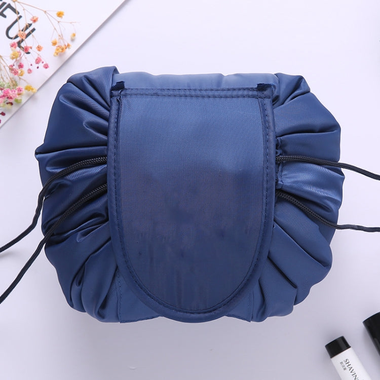 Navy blue drawstring cosmetic storage bag with rounded front panel and cords
