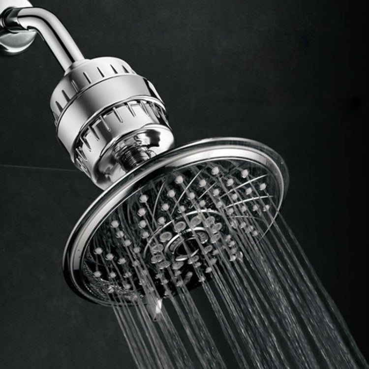 Chrome shower filter head with spray nozzles, close-up water stream