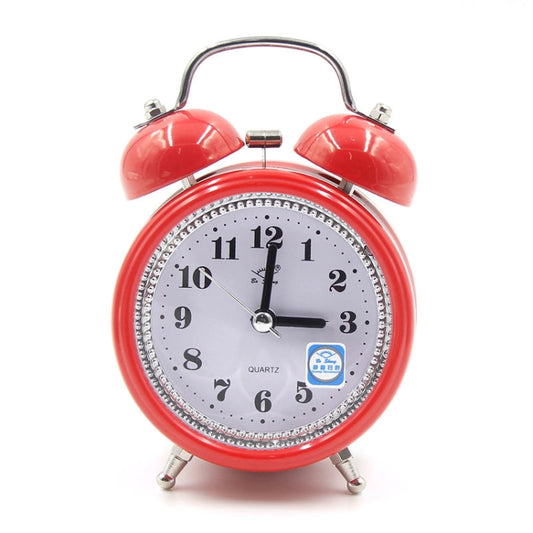Red metal twin bell alarm clock with analog face and quartz display, top handle and feet.