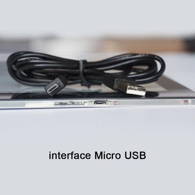Micro-USB port on LED light pad with connected USB cable
