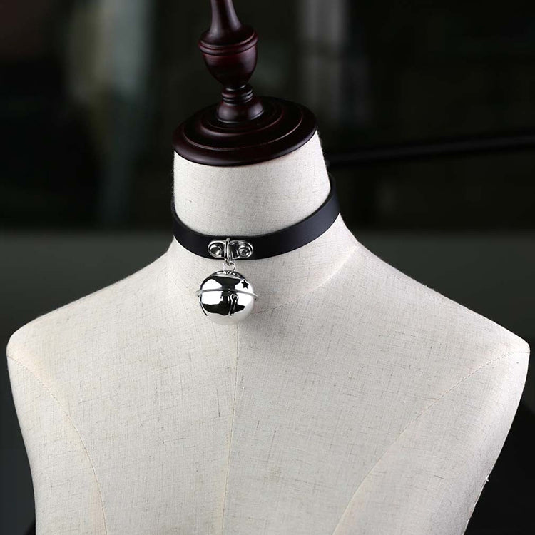 Black studded leather choker with round bell pendant on a mannequin