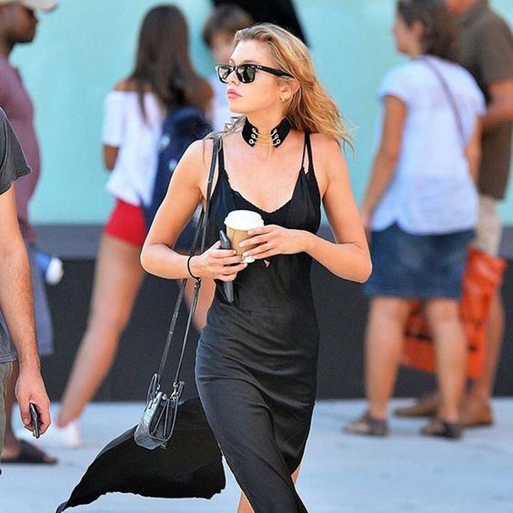 Black velvet ribbon collar choker necklace worn by a woman
