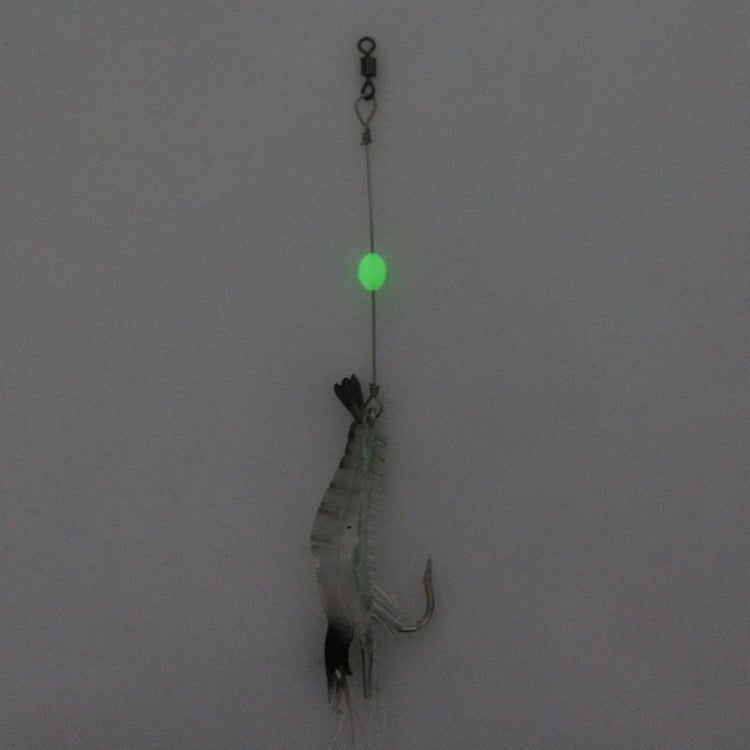 Shrimp lure hanging on line with treble hook and glowing green bead