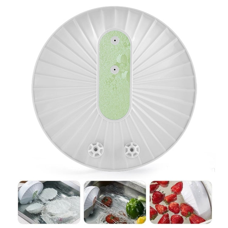 Portable mini ultrasonic dishwasher with white round body and green control panel.