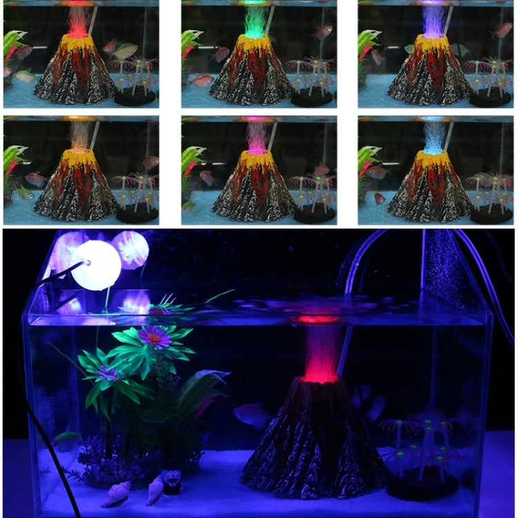 Aquarium scene featuring a volcano decoration under colorful LED lighting and water flow effect.