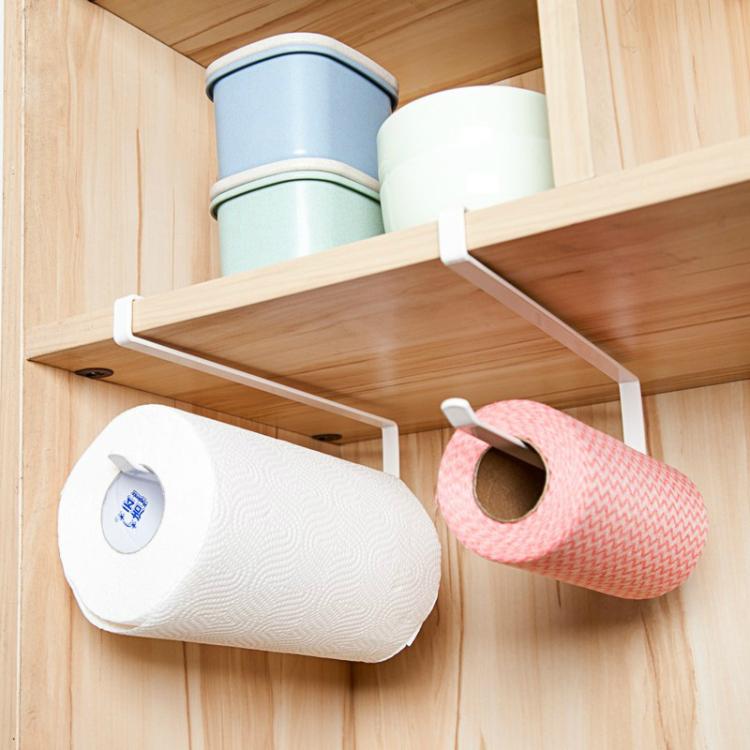 White paper towel rack with holder, holding white and pink rolls