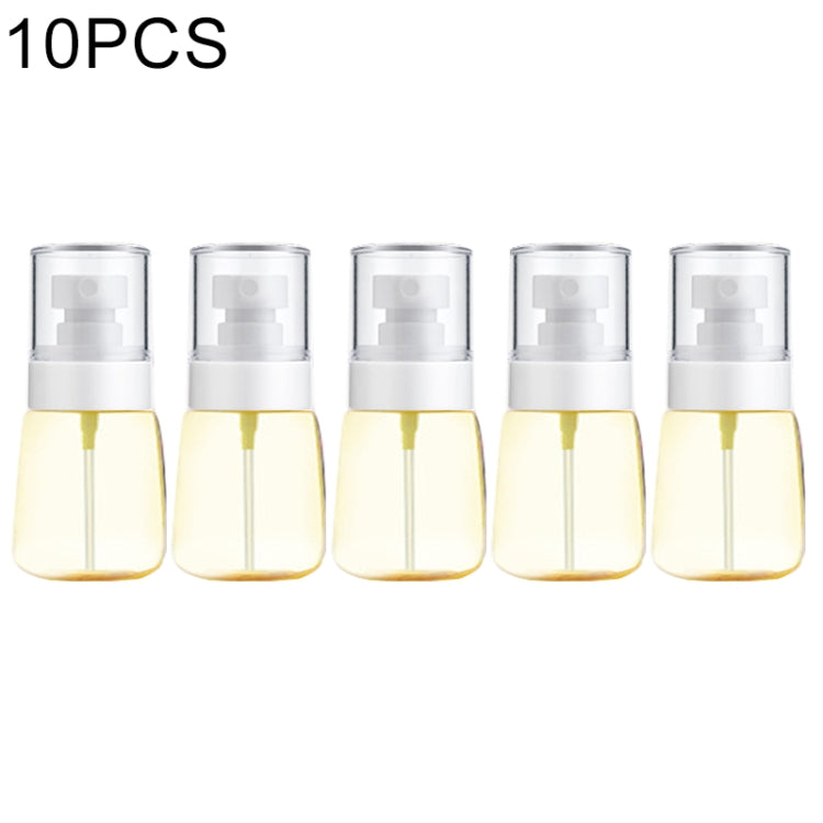 10-pack portable refillable fine mist spray bottles, transparent with yellow liquid and white pump