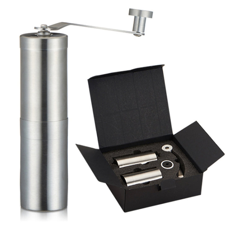 Manual stainless steel conical burr coffee grinder with crank handle; open box with parts