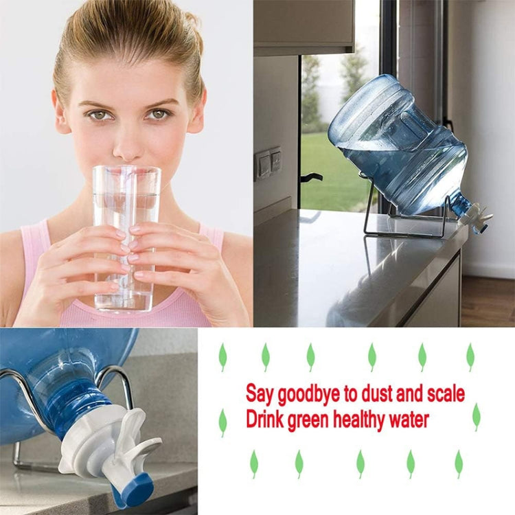 Water bottle faucet dispenser valve in use dispensing clean water into a glass