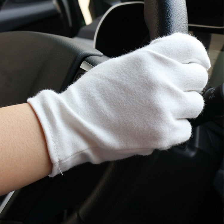 White cotton working glove with thick knit cuff on hand