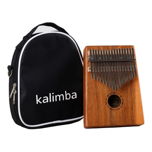 Wood kalimba with metal tines and circular sound hole; includes black zip case.