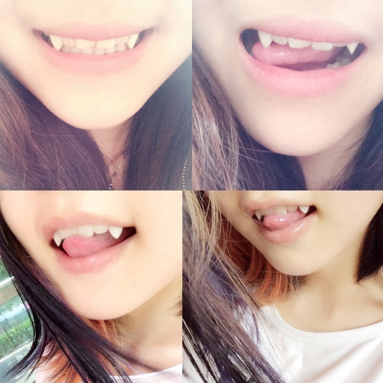 Vampire fang dentures with two pointed white fangs, close-up on smiling mouth