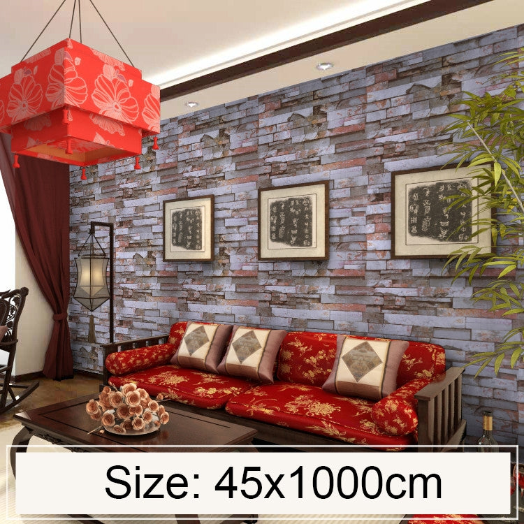 Grey-brown stone brick wallpaper covering wall behind sofa, with framed art decor