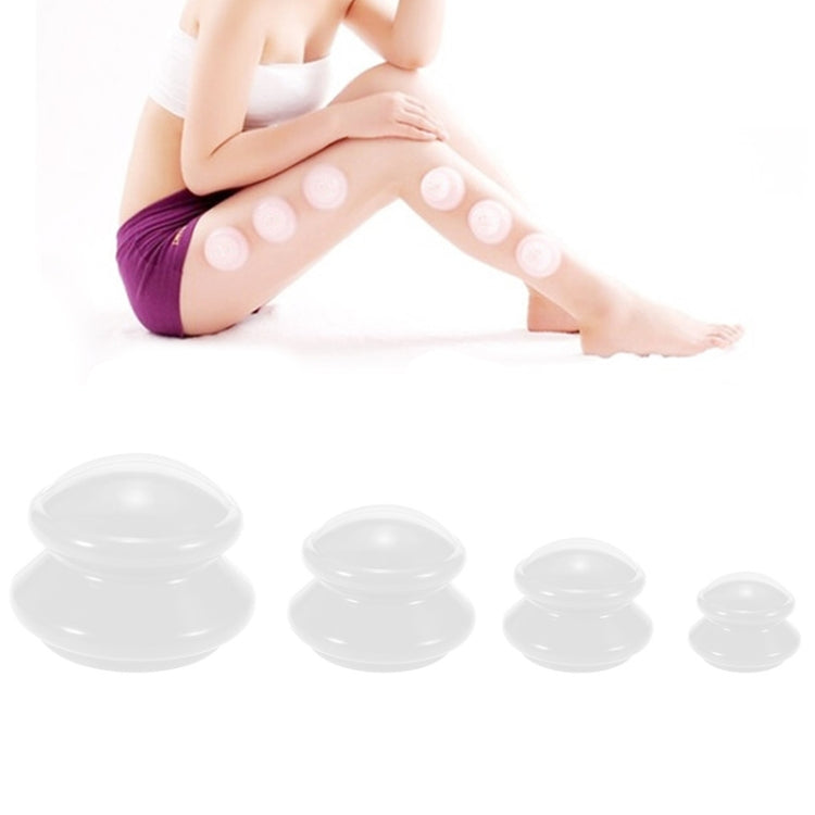 Clear silicone vacuum cupping cups on leg, four domed suction domes