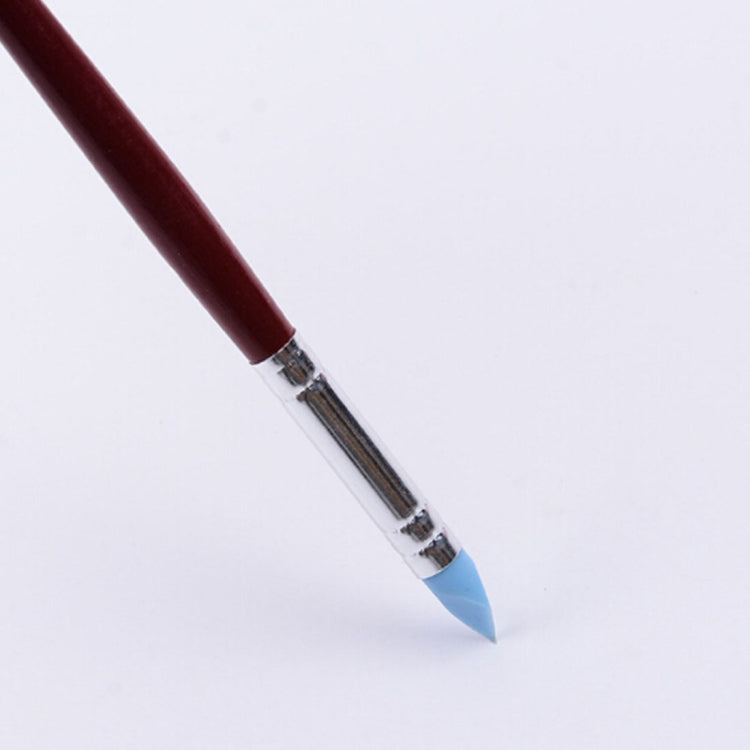 Clay sculpting tool with red rubber handle and blue pointed shaping tip