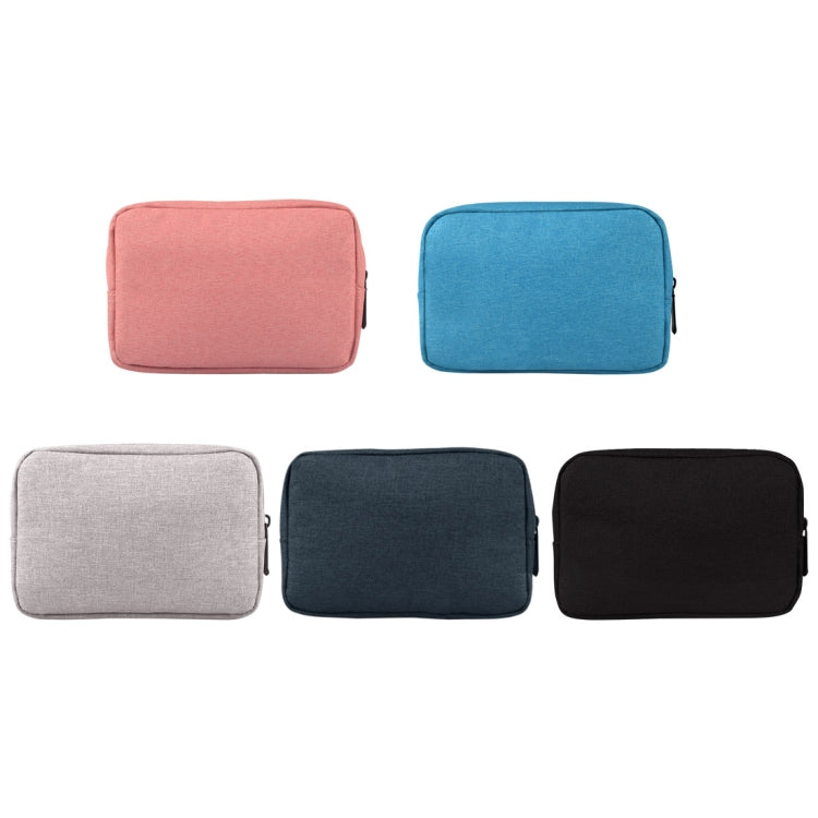 Assorted travel tech storage pouches in pink, blue, grey, navy, and black with zippers