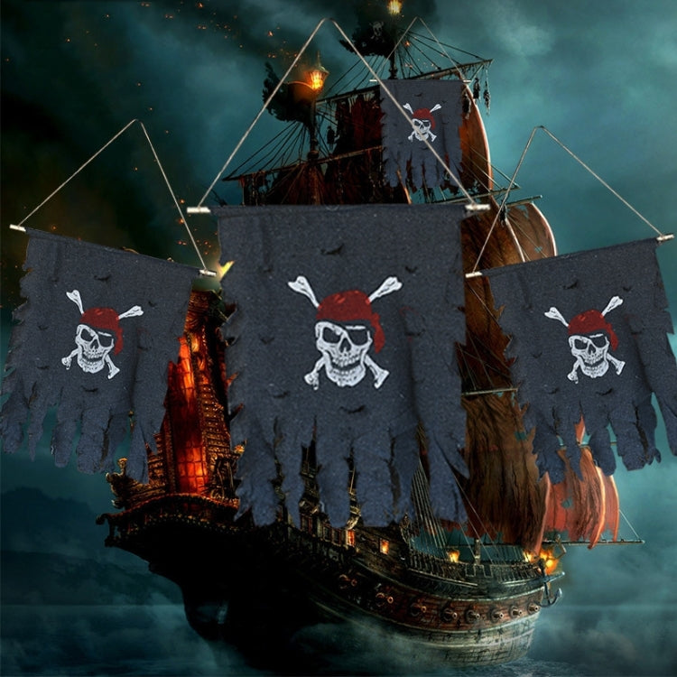 Multiple pirate skull banner flags in dark blue with white skull and red bandanas