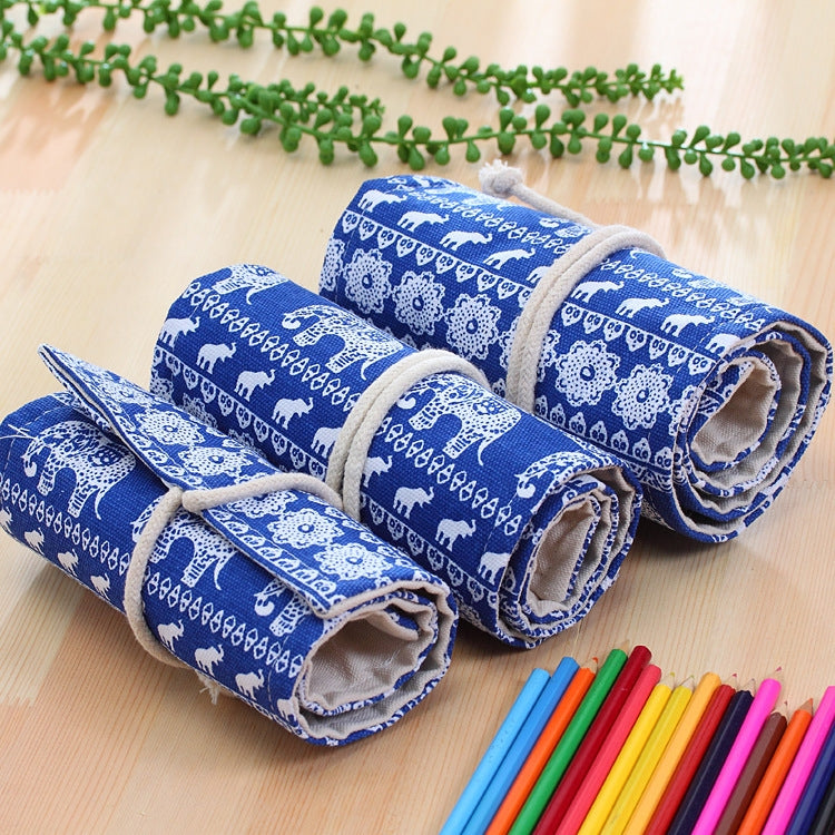 Blue canvas pencil roll-up case with decorative motif, secured in wrapped sections