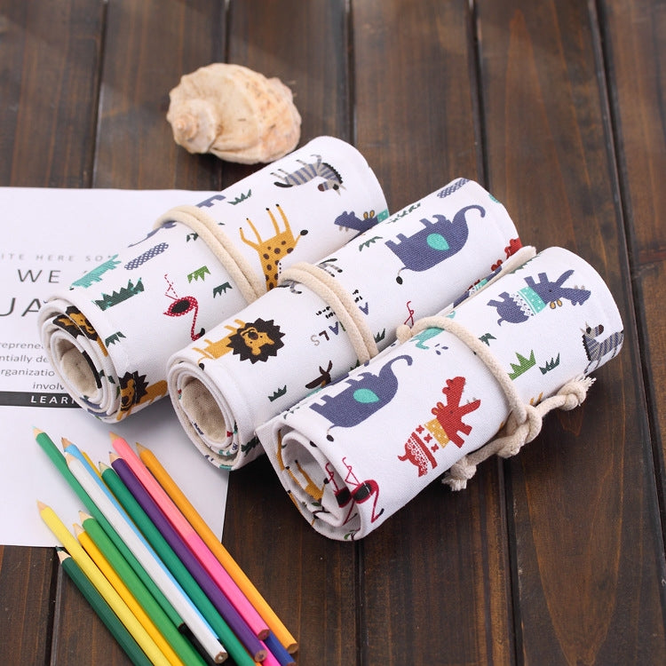 Canvas pencil roll-up case with white dinosaur print, rolled and tied, pencils inside