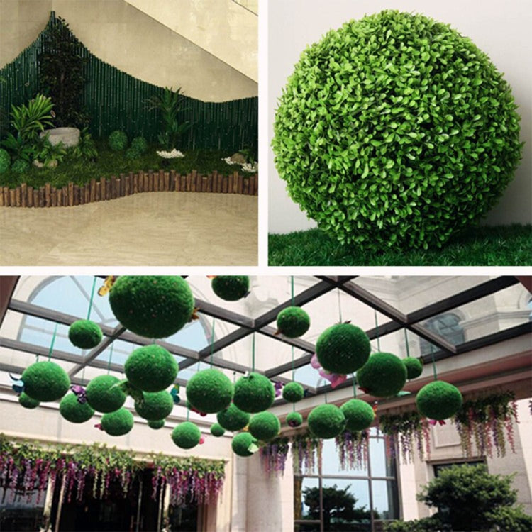 Artificial green topiary ball and hanging pom-pom garland display
