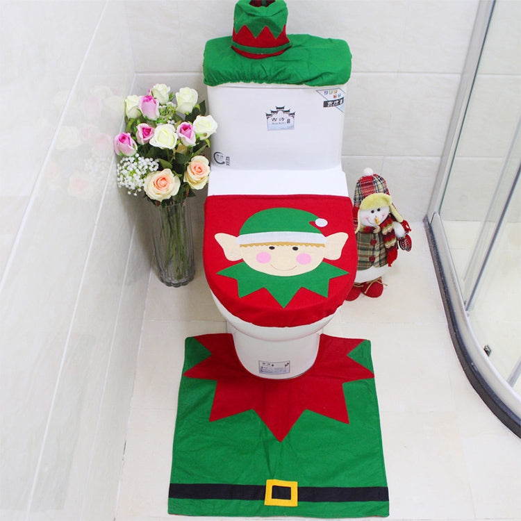 Christmas elf bathroom set: green rug, red-trimmed seat cover, and matching elf hat